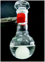 Separation of [PBu4][NTf2] (paraffin ball) from water layer in ILICM process.