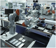 Graphical abstract: Modular, multi-robot integration of laboratories: an autonomous workflow for solid-state chemistry