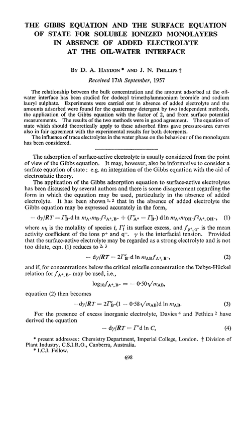 The Gibbs equation and the surface equation of state for soluble ionized monolayers in absence of added electrolyte at the oil-water interface