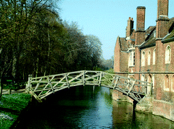 Queen's College site sits astride the River Cam, the two halves joined across the river by the famous Mathematical Bridge — more correctly called The Wooden Bridge built in 1749 by James Essex the Younger to the design of William Etheridge.