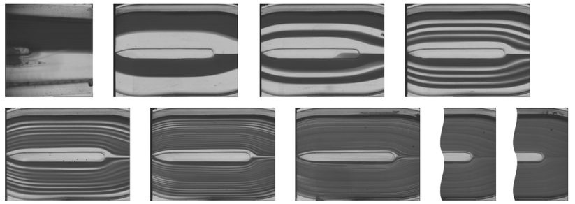 Optical inspection of multi-lamination in the SAR mixer. The dyed (water-blue) and transparent lamellae of an 85% glycerol–water solution are shown in dark and light grey, respectively. The applied total volume flow rate of 0.2 l h−1 corresponds to Re = 0.22.