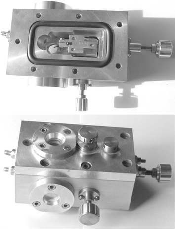 Top and bottom: images of the hyperbaric cell for VSD imaging studies of neuronal signal propagation. Top: the specially designed carriage for x-, y-, z-manipulation of the electrode assembly is seen, with the electrode poking down into the circular brain slice mounting area. Bottom: the cell assembly is shown with the viewing windows in place. Pumping of artificial cerebrospinal fluid (aCSF) to achieve hyperbaric conditions is achieved through the inlet and outlet connections on the right, and electrode manipulation occurs by turning the knurled brass knobs. The cell fits underneath the VSD fluorescence microscopy imaging instrument.
