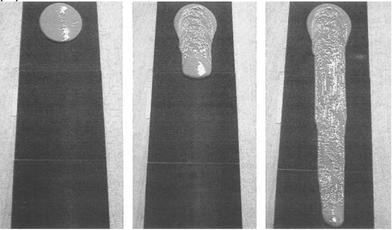 Avalanche flow of a clay suspension over an inclined plane covered with sandpaper. The experiment was performed just above the critical angle, below which the fluid behaves like a solid.14