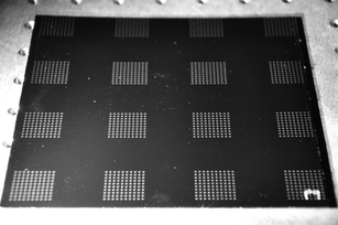 Photo of painted metal surface with 16 arrays of sebum dots dispensed with the Asymtek printer system.