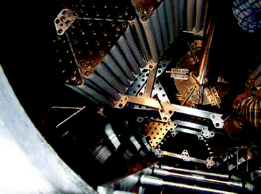 Construction installed in a 15 m3 fermenter with the aim to hold 400 m2 of polyurethane tubes as a matrix for the immobilization of microbial cells by adsorption for the production of an oxidoreductase. One can see the Rushton impellers, flow breakers on the wall and the polyurethane tubes being mounted on a scaffold in the reactor. For scale: note the engineer installing the tubes in the upper right corner of the picture, standing on the top impeller (copyright @ Lonza s.r.o. Czech Republic).
