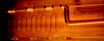 Formation of the Taylor flow regime in a glass micro-mixer prior to the washcoated microchannel reactor.